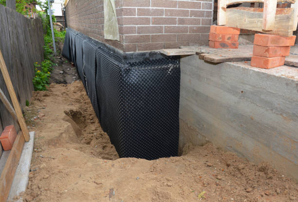 SJ Waterproofing Pros technician performing targeted Basement Waterproofing assessment in Wyckoff, NJ